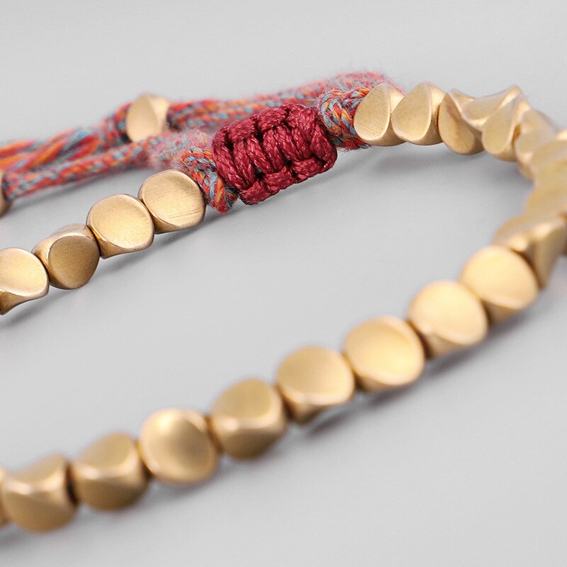 Black gold and gray hand braided Tibetan bracelet  Artisan dAsie